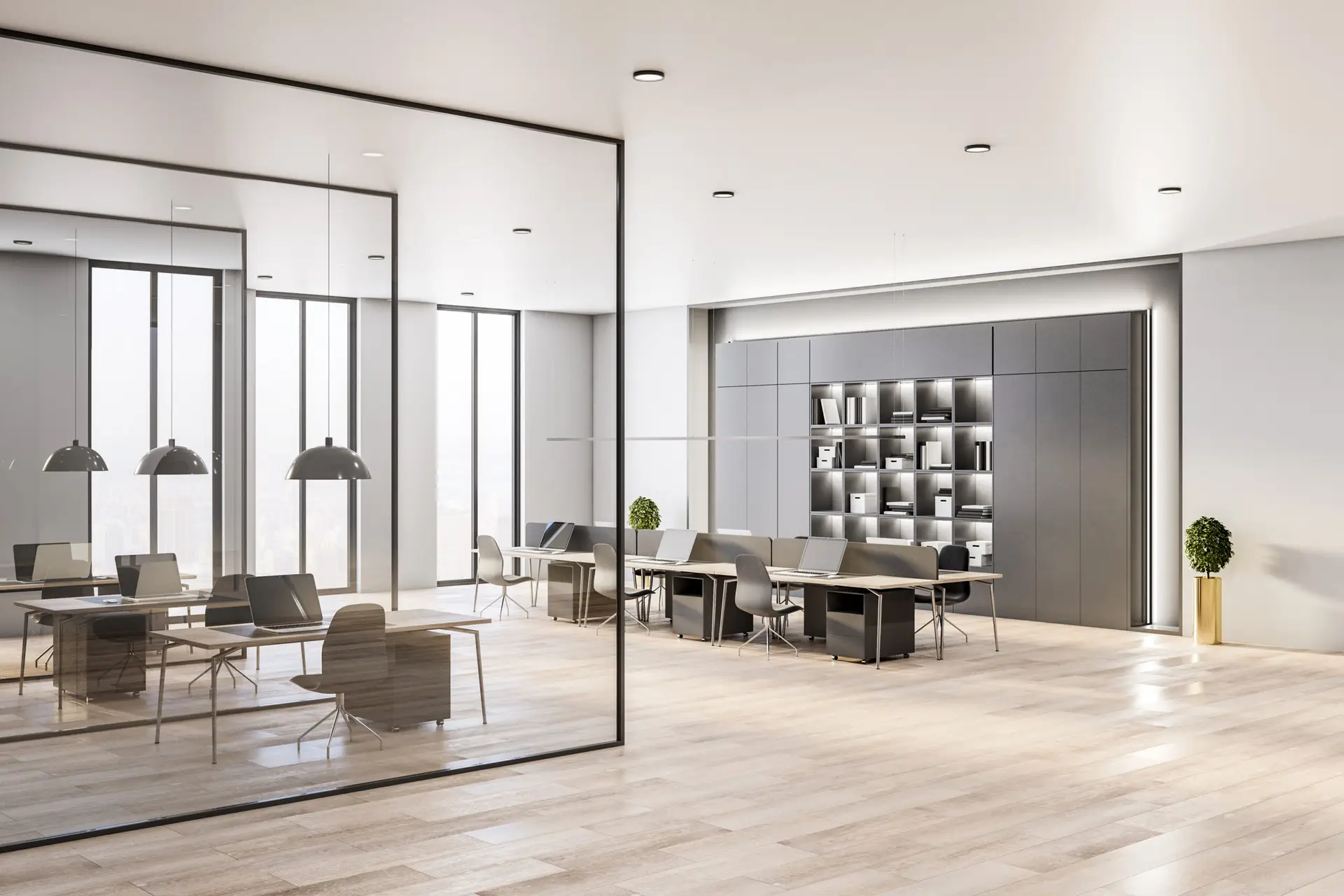 Modern office with glass walls, wooden floors, sleek desks, black chairs, pendant lights, and a wall shelf with books.